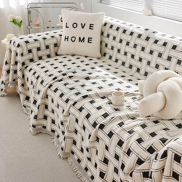 Elegante cubierta de sofá de tasas con borde con flecos a cuadros